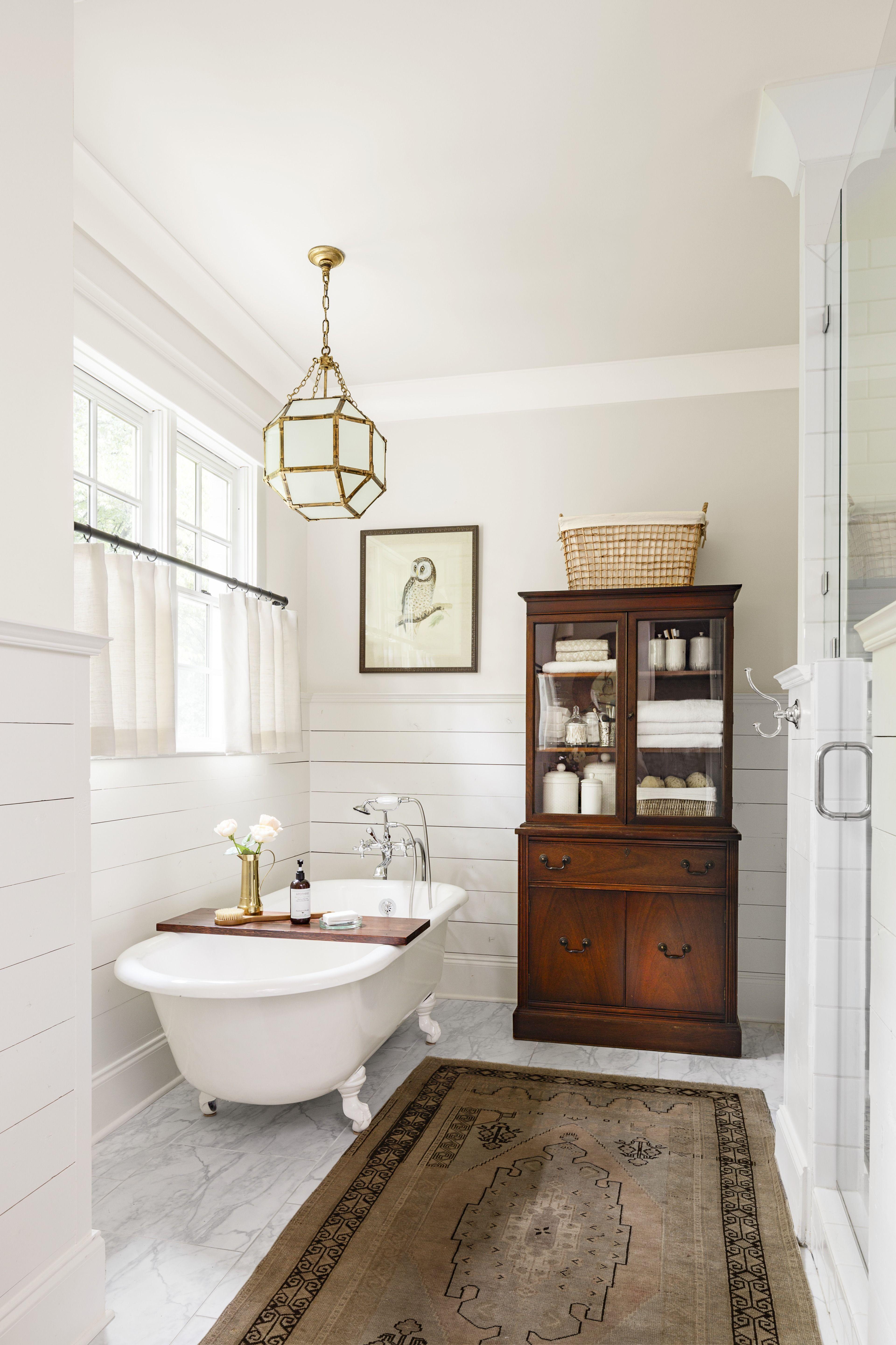 Install a classic clawfoot tub for stunning focal point in your farmhouse bathroom