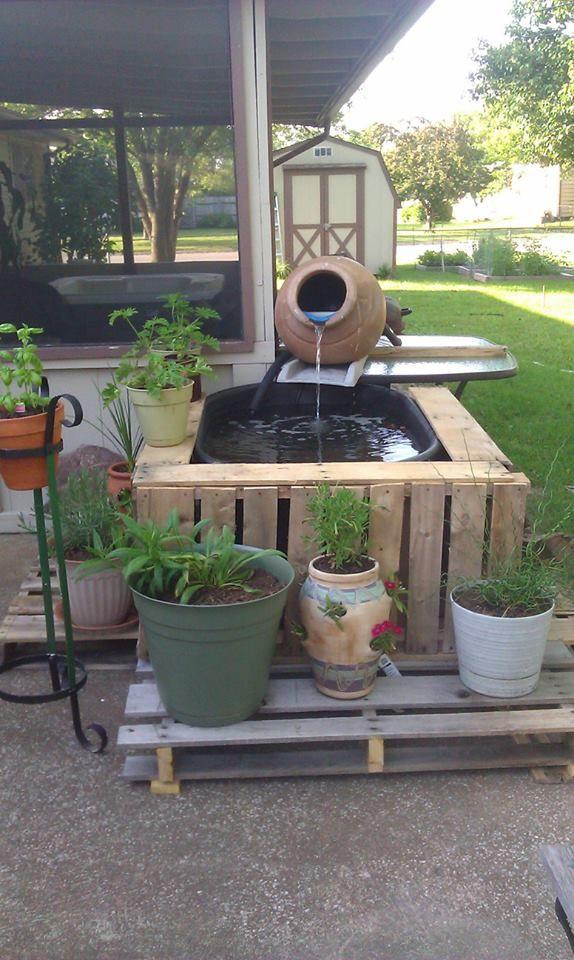 Design a pallet garden fountain for a serene backyard oasis