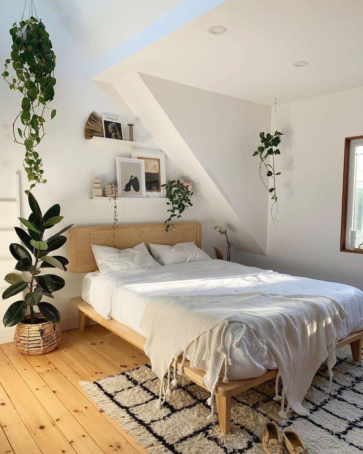 Add a plant or two for freshness in a minimalist bedroom