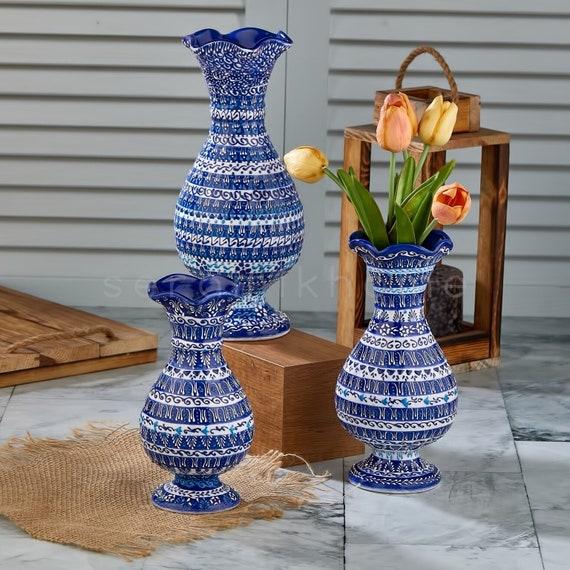 Decorate ‌with blue ceramic vases for a stylish centerpiece