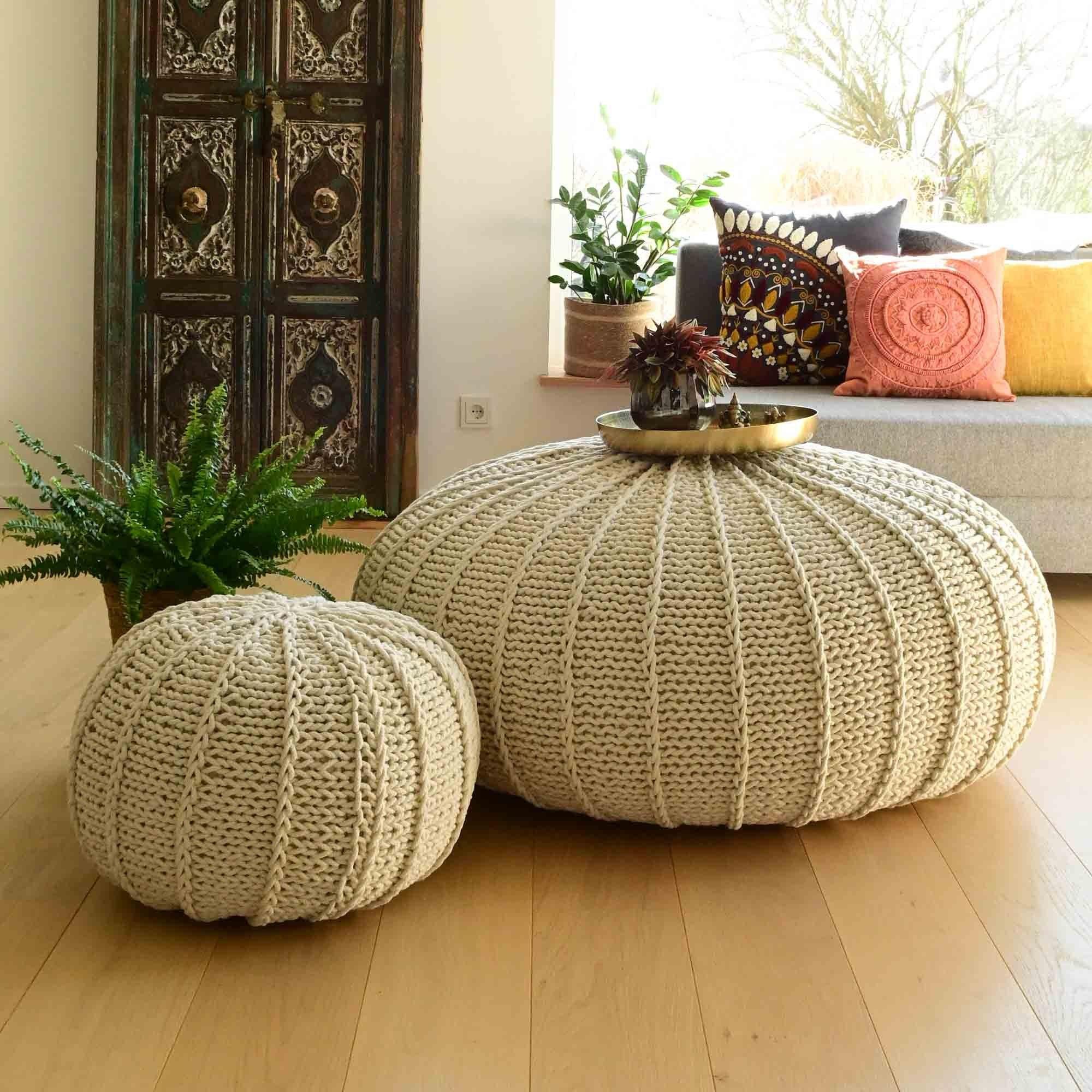 Invest in oversized knit poufs for relaxed seating in your ‍inviting Boho Living Room