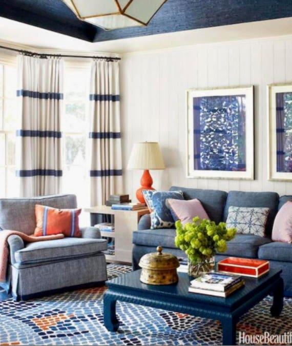 Experiment with blue ⁢striped ⁤curtains‌ for a playful touch in ​your living room