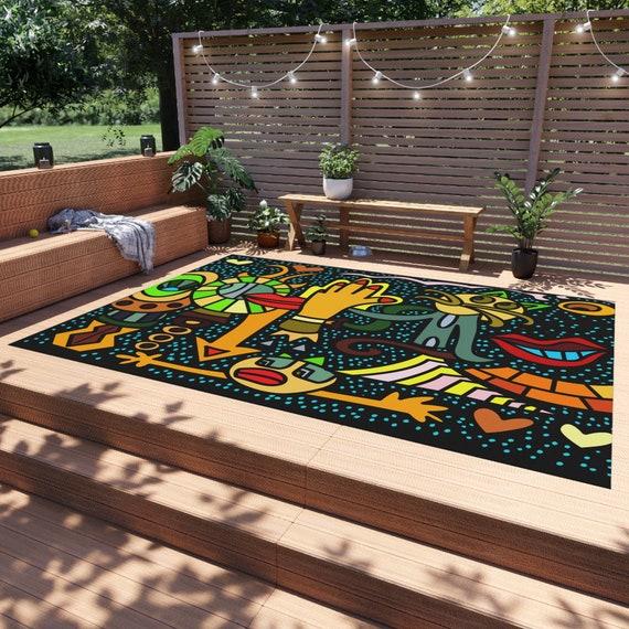 Incorporate colorful outdoor rugs to define spaces in your backyard