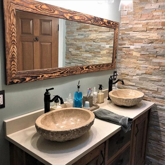 Hang antique mirrors to add character to your farmhouse bathroom décor