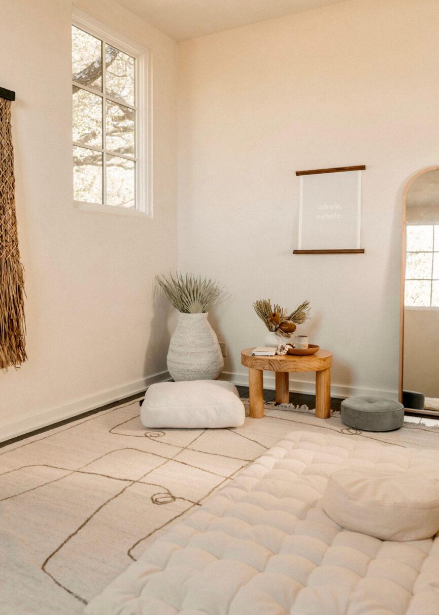 Create a designated relaxation corner in your minimalist bedroom