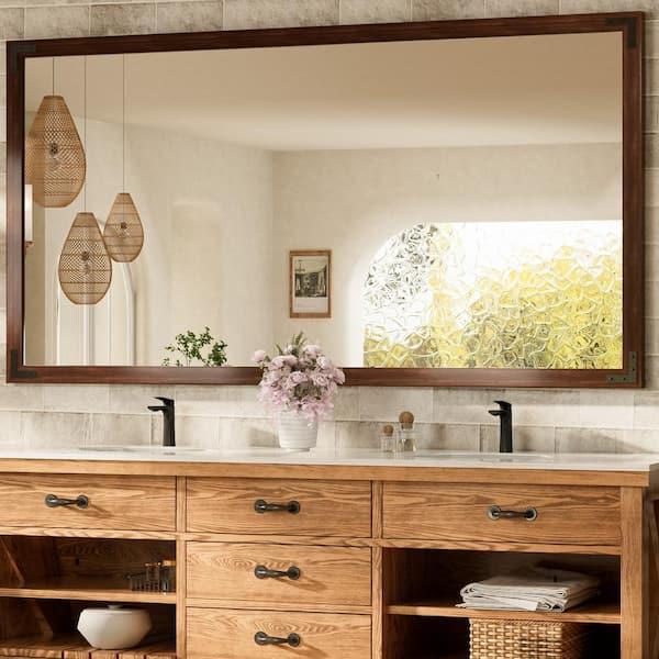 Hang wooden mirrors for a functional yet​ stylish addition to your wooden bathroom