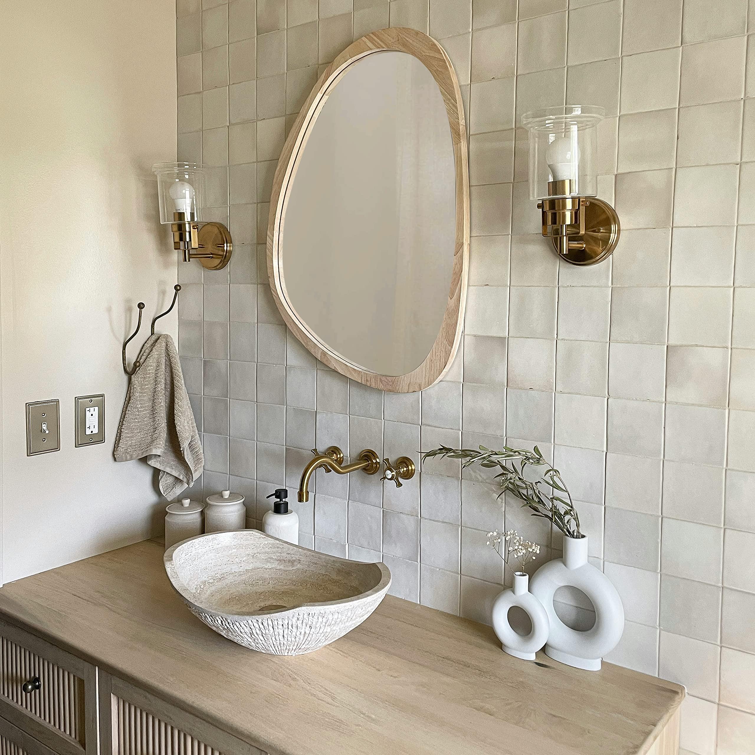 Natural wood mirror⁣ to elevate your boho bathroom ambiance