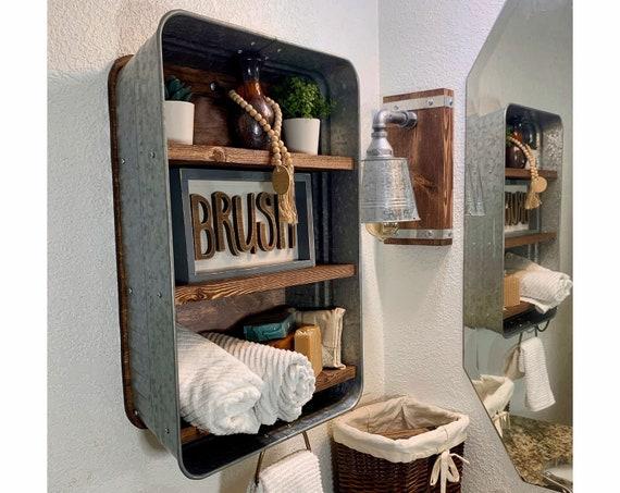 Incorporate rustic wooden shelves for practical storage and charming decor in your farmhouse bathroom