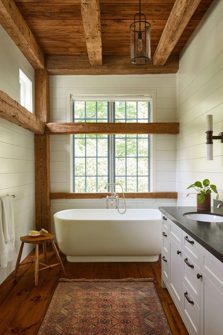 Install wooden bathroom beams for an architectural statement