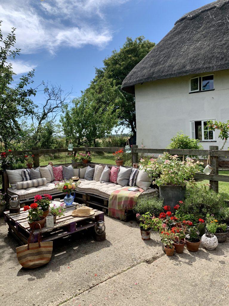 Use repurposed furniture for unique backyard seating arrangements