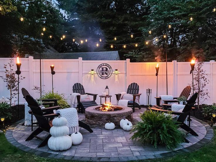 Create a fire pit area for warm gatherings in your backyard oasis