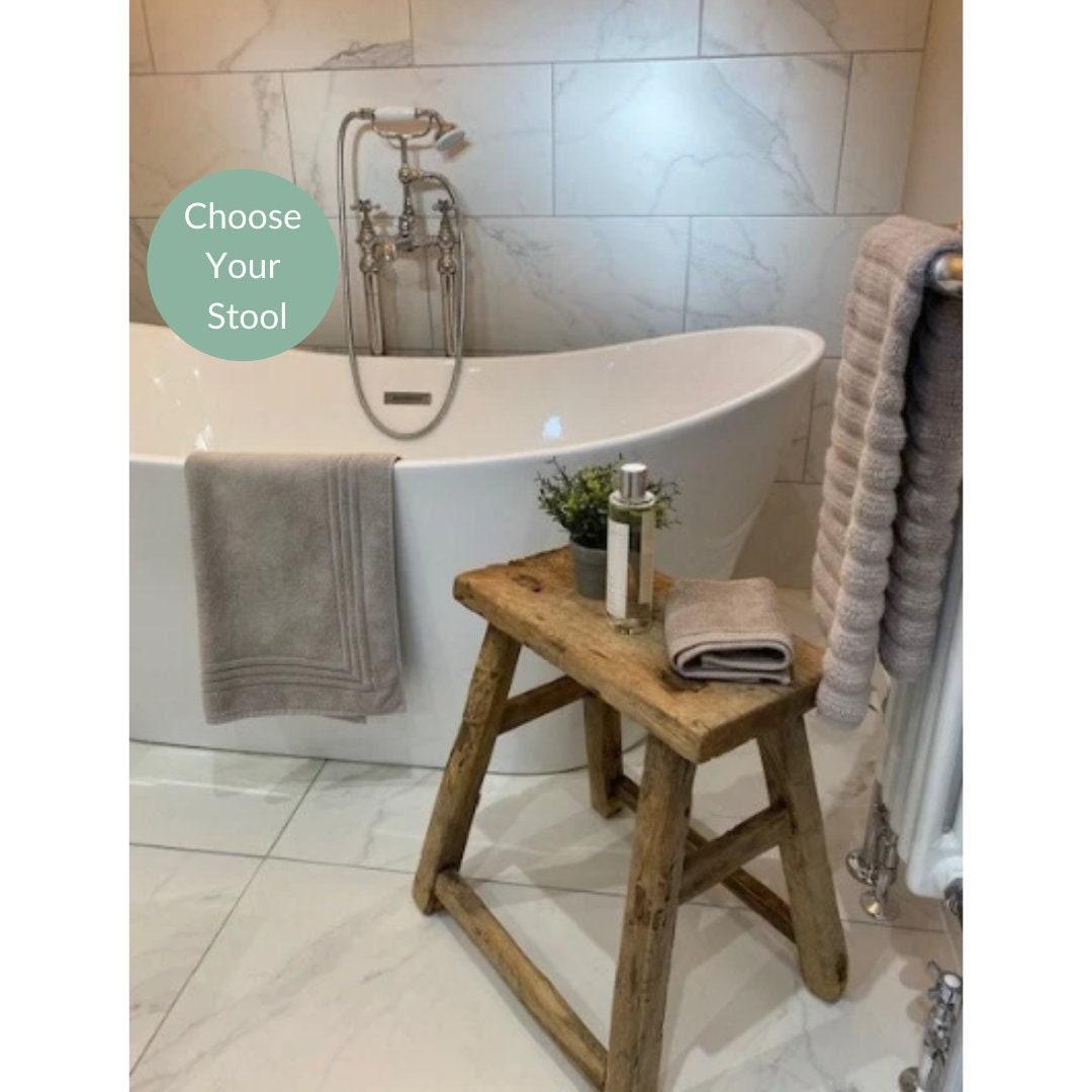 Add a wooden stool for practical⁢ seating and rustic charm in your ‌farmhouse bathroom