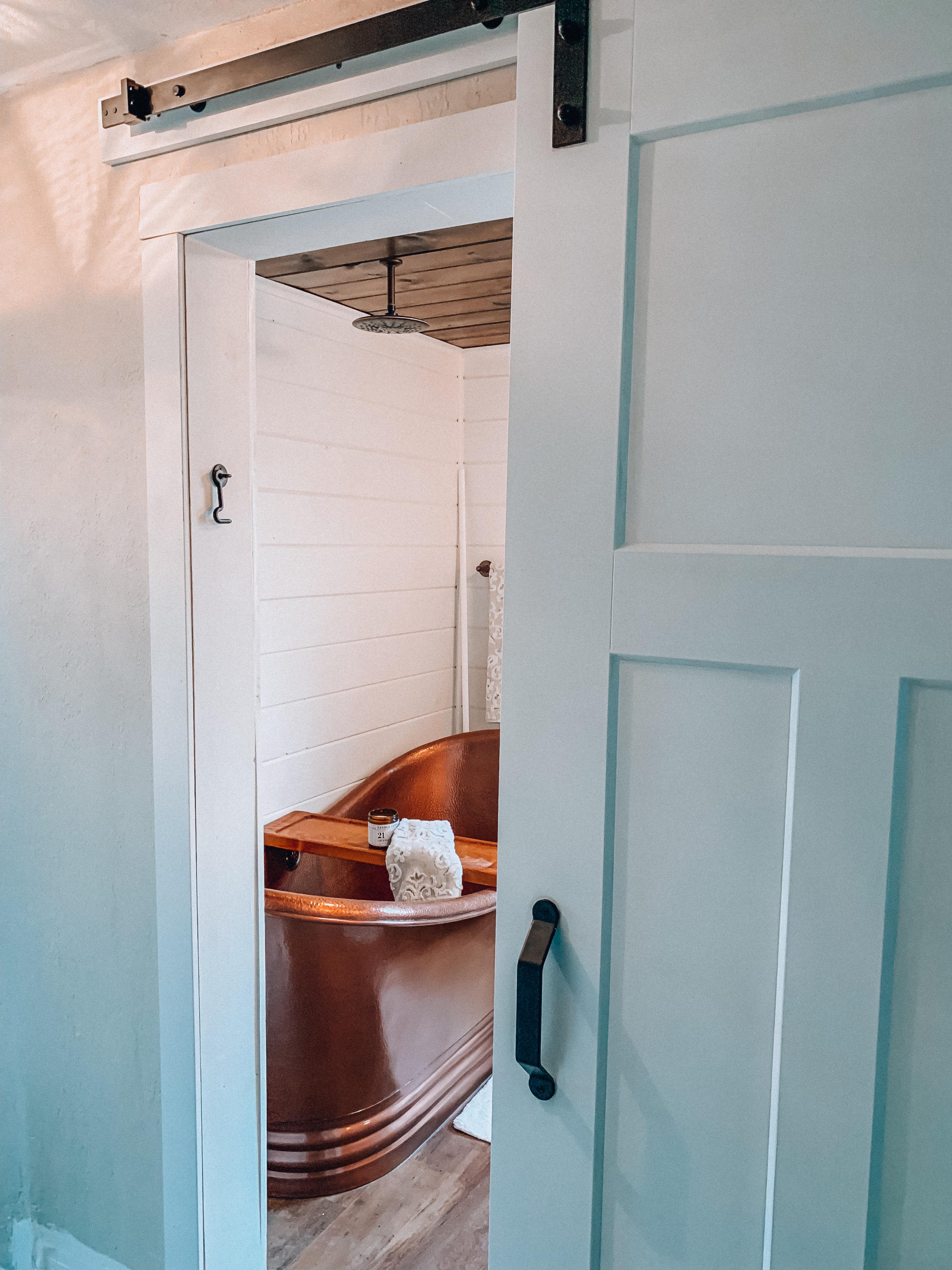 Opt‌ for ​a sliding barn door to save space and add character to ‍your wooden bathroom