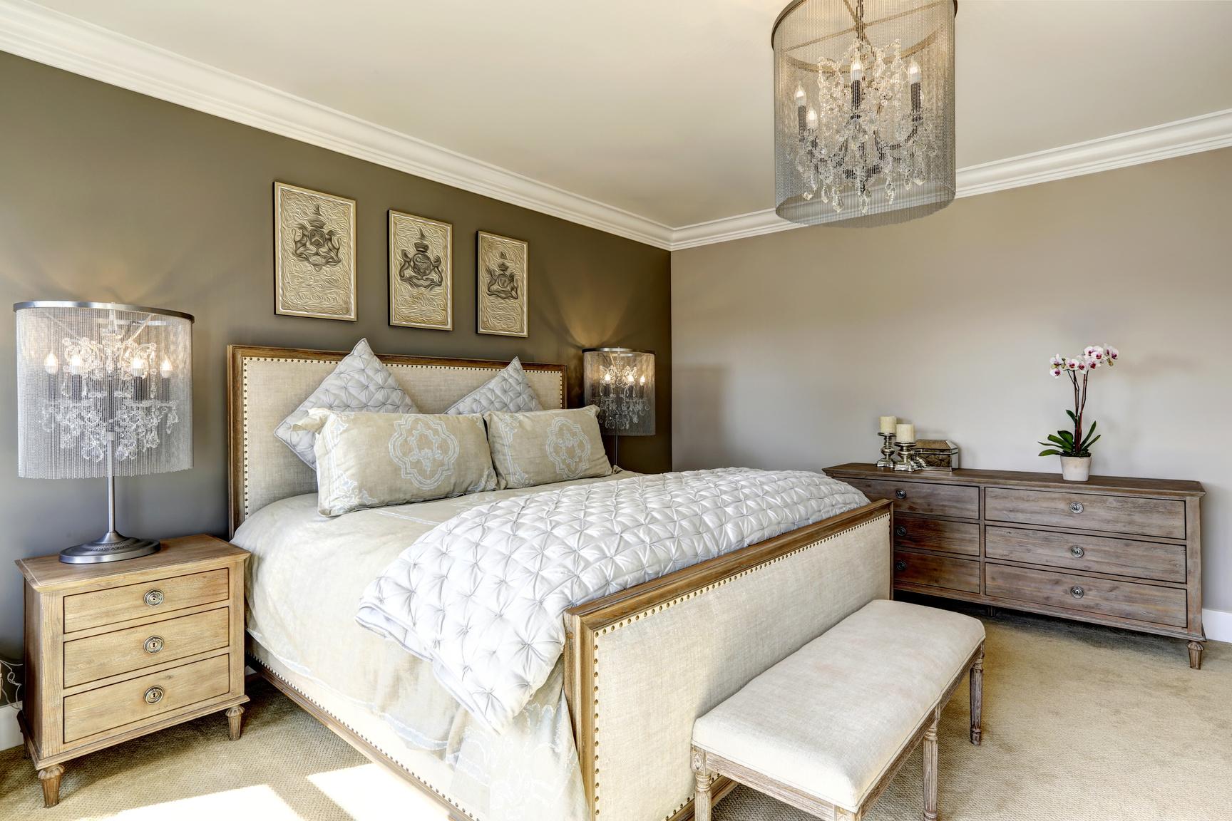 Statement lighting ​fixtures enhance ambiance, elevating your decor with this chic bedroom trend