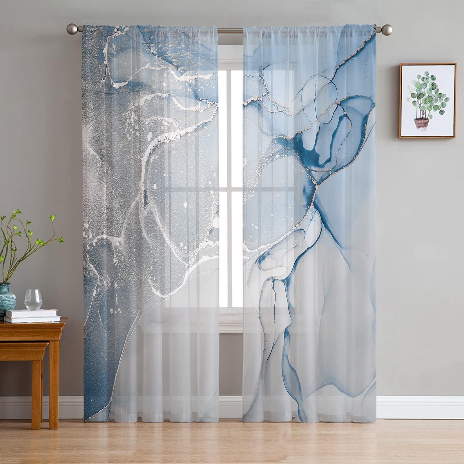 Install sheer curtains for soft light in ⁣a blue living room