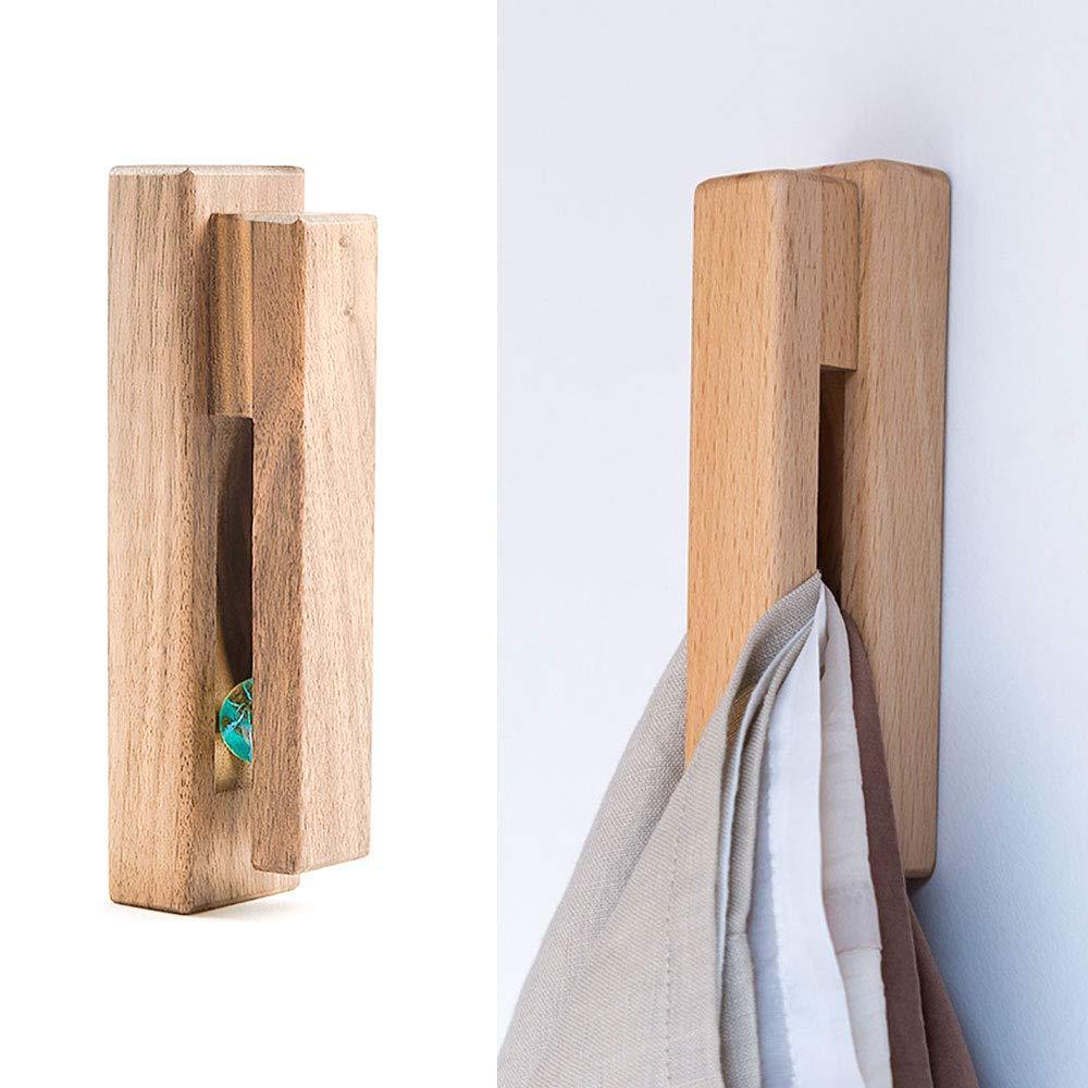 Use wooden wall hooks for a rustic and functional touch in your wooden bathroom