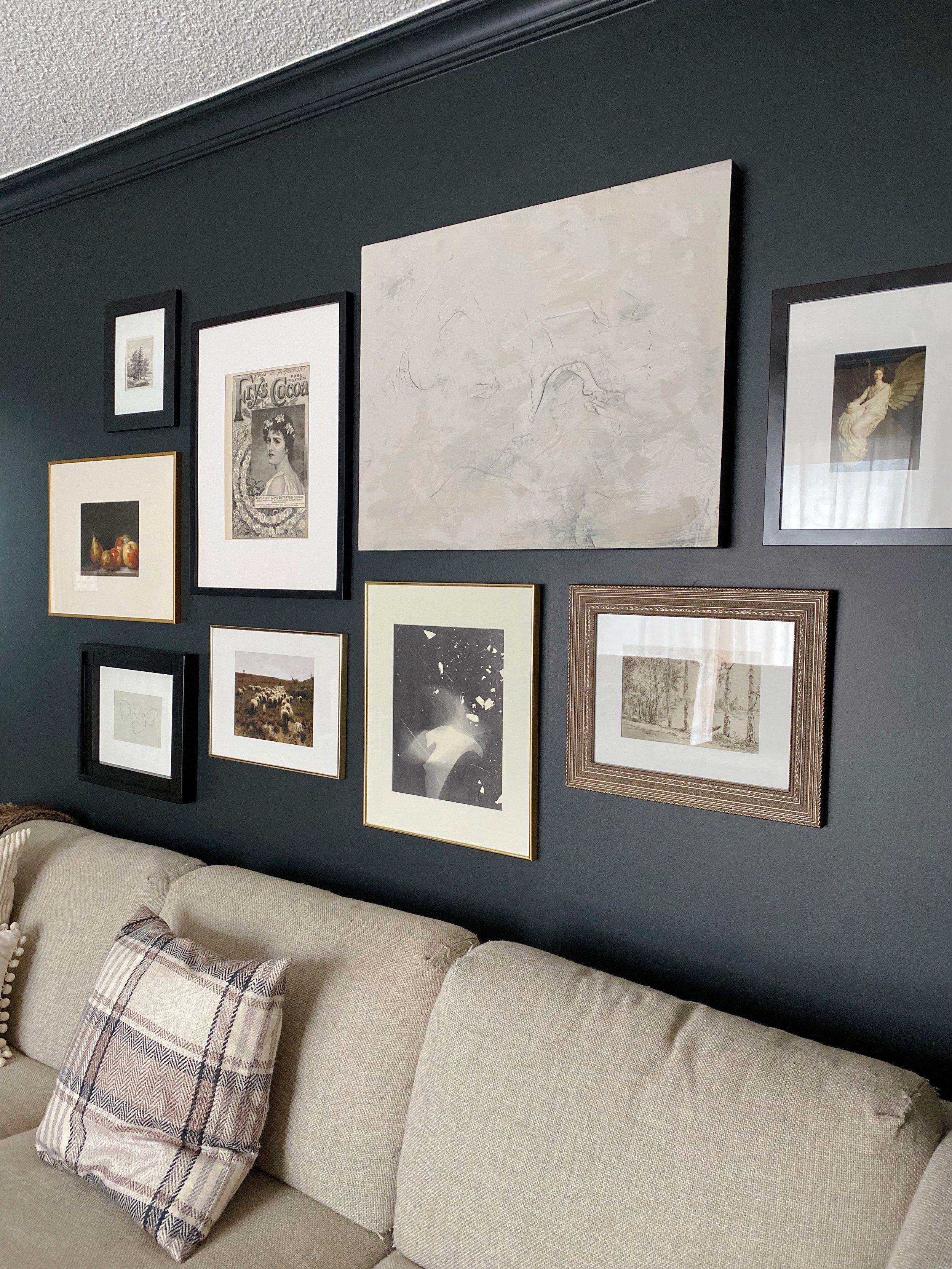 Create a gallery wall of family photos for a personal touch in your vintage living room