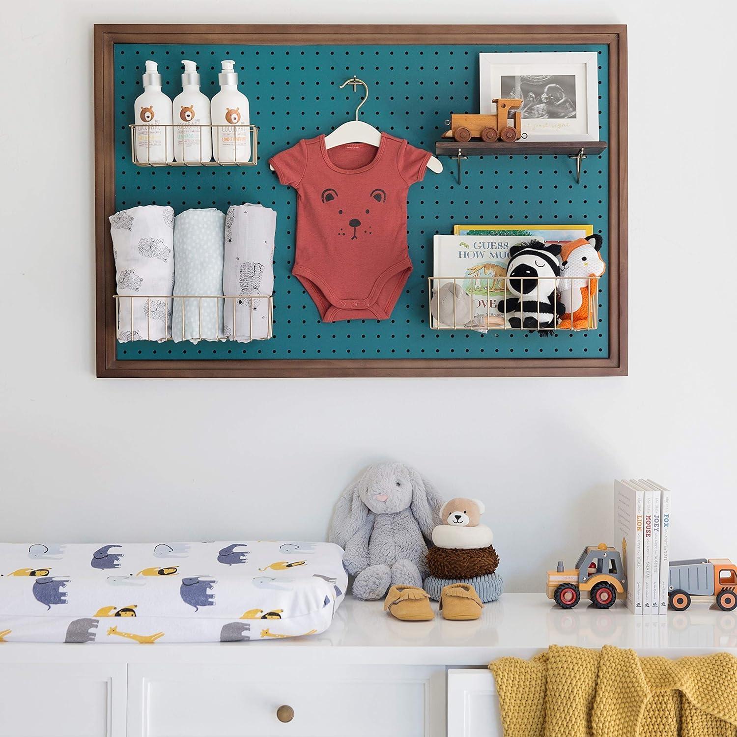 Use a pegboard for flexible organization in your small ​nursery