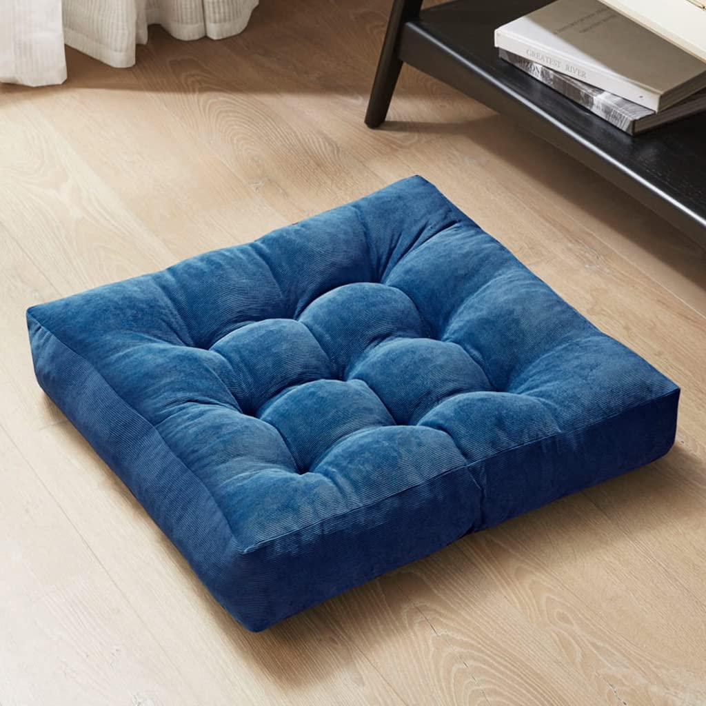 Use oversized cushions ​for comfort in your blue living room