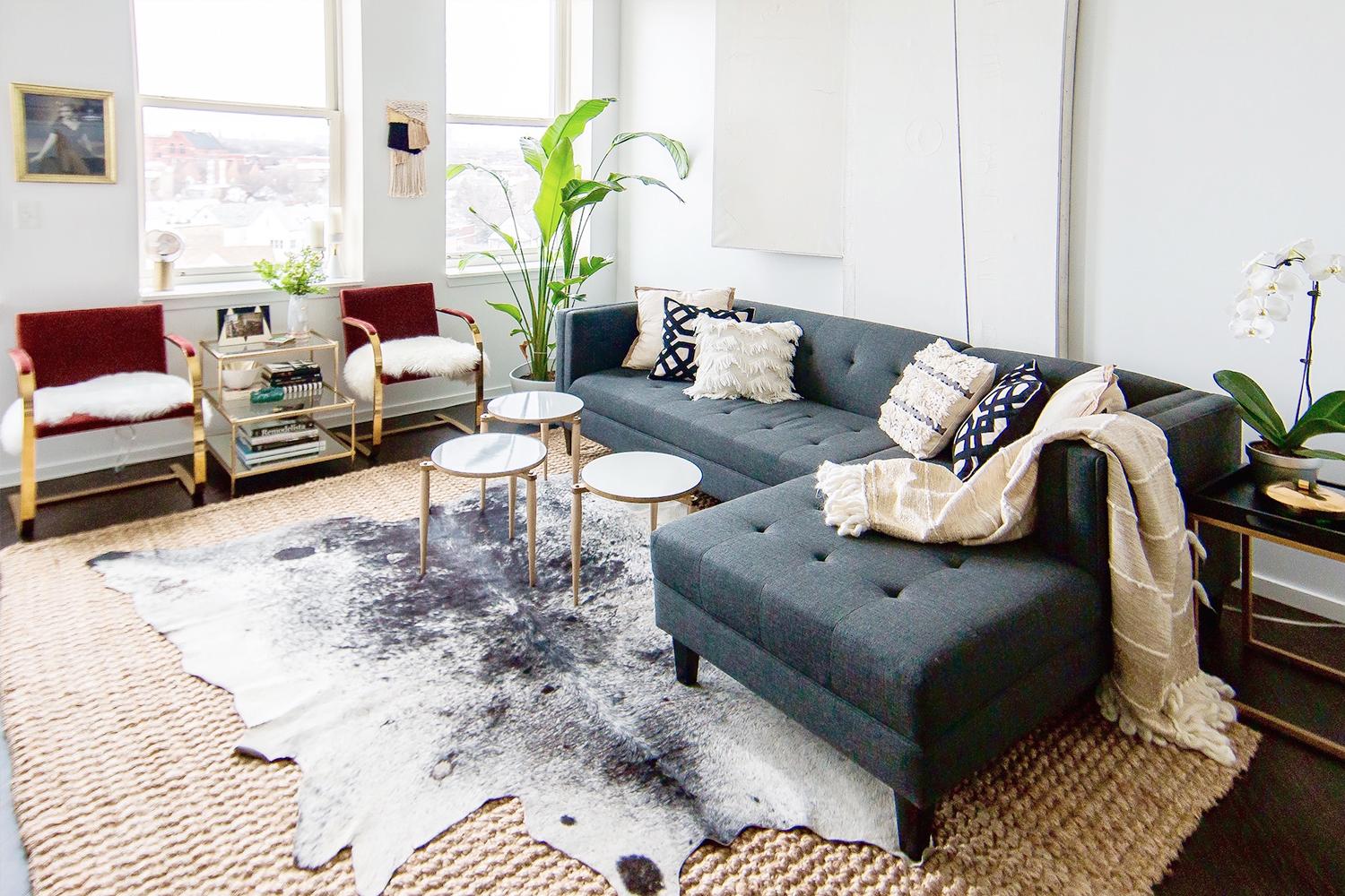 Layer rugs for depth and warmth‌ in your interior design