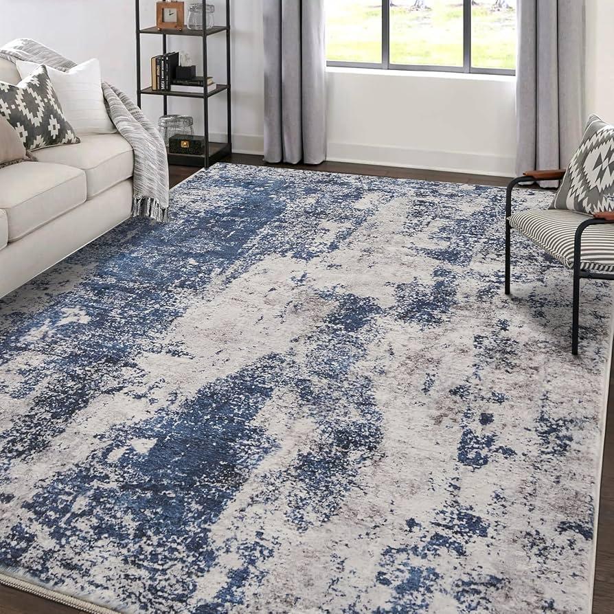 Use ⁤a blue ‍area ​rug to define your living room ⁢space