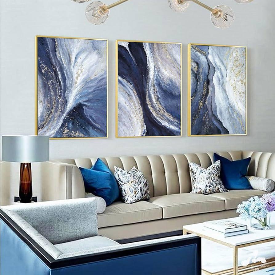 Accessorize with golden​ accents for a glamorous blue living room