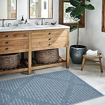 Layer woven rugs to enhance comfort in your boho bathroom