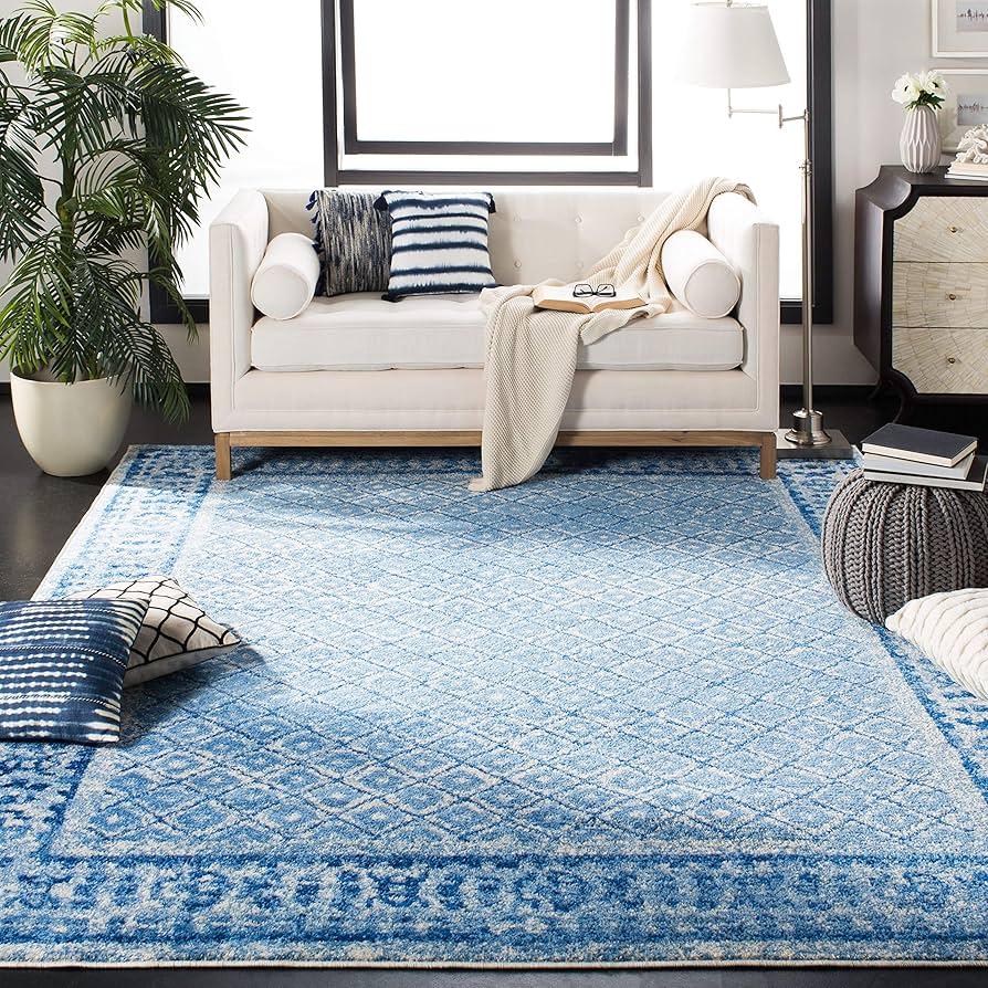 Use a bold blue rug to anchor the blue‍ living room