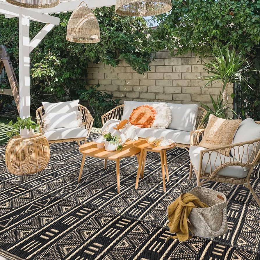 Inviting outdoor rug to define spaces in your backyard