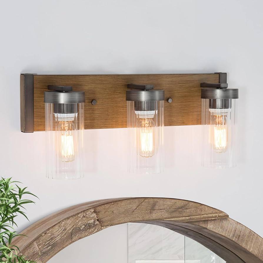 Create a warm ambiance with soft lighting fixtures throughout your wooden bathroom