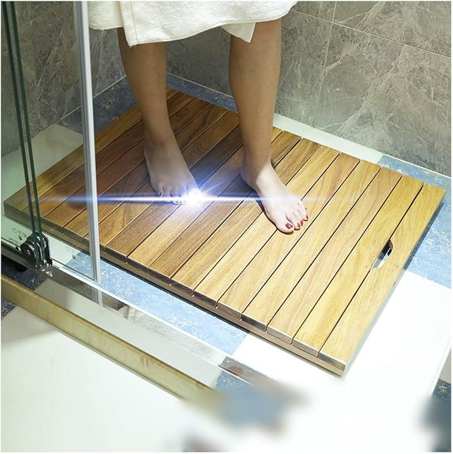 Enhance tranquility with a wooden shower mat in your cozy wooden bathroom