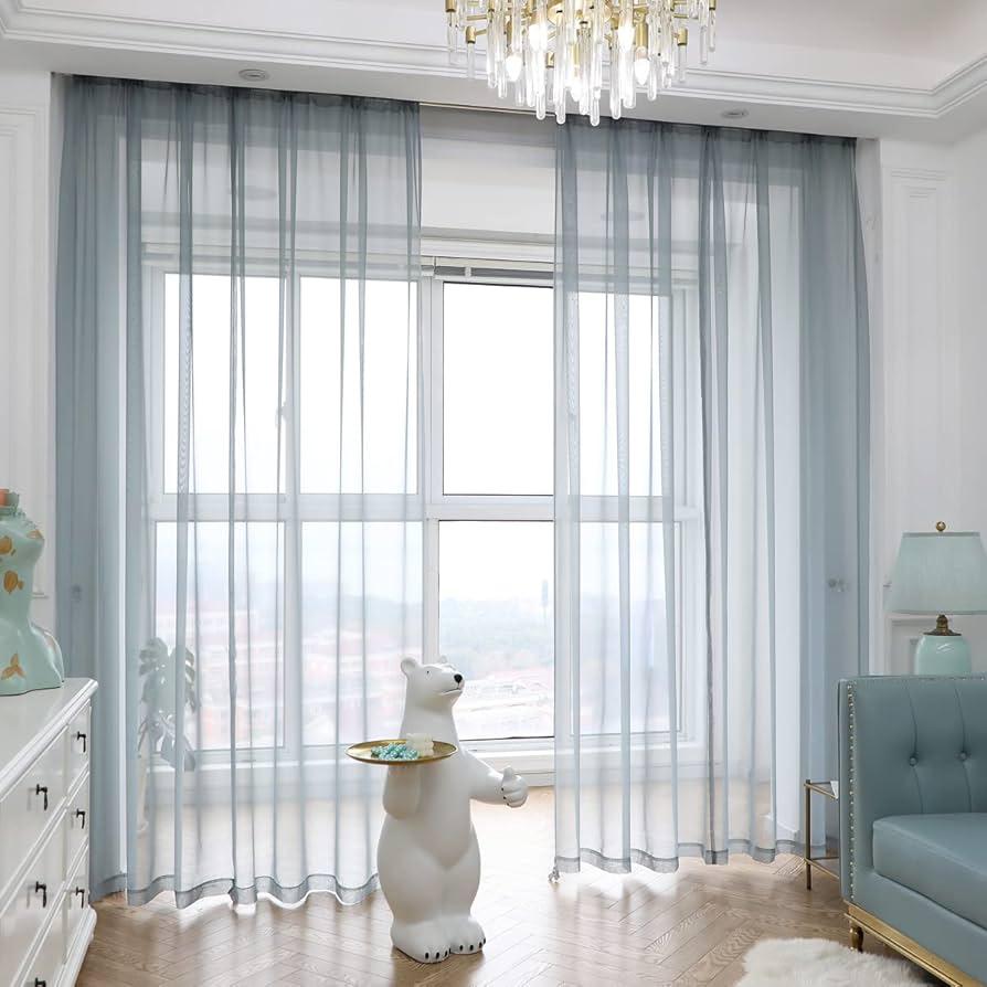 Incorporate natural light sources with sheer curtains for a bright, airy earthy living room