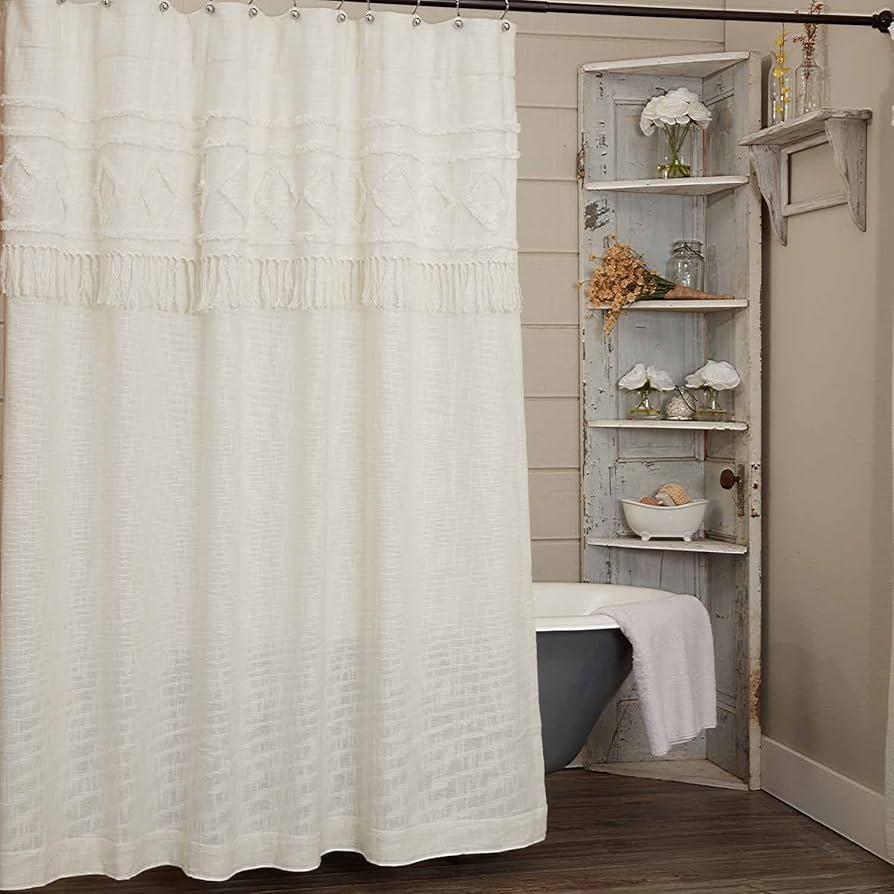 Fringed shower curtains adding texture to your boho bathroom design