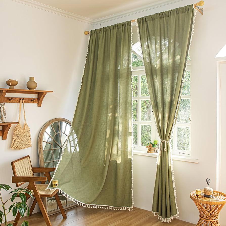 Incorporate fabric drapes for soft lighting and privacy in your Boho Living Room