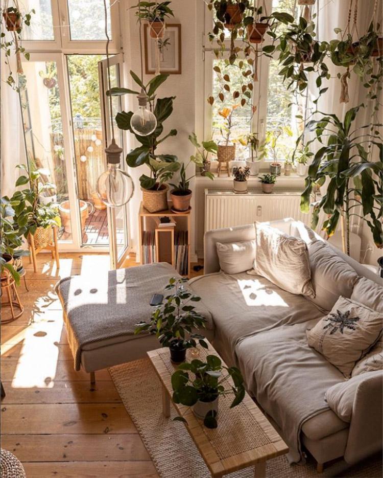 A collection ‍of potted plants​ breathes ​life‌ into your Boho Living Room ambiance