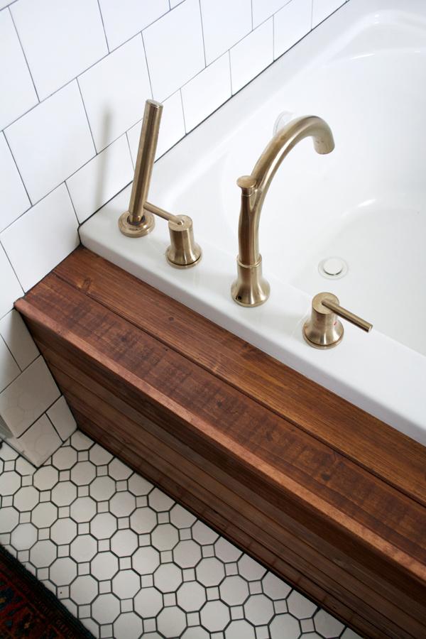 Install a wooden bathtub for a luxurious and relaxing focal point in your wooden bathroom