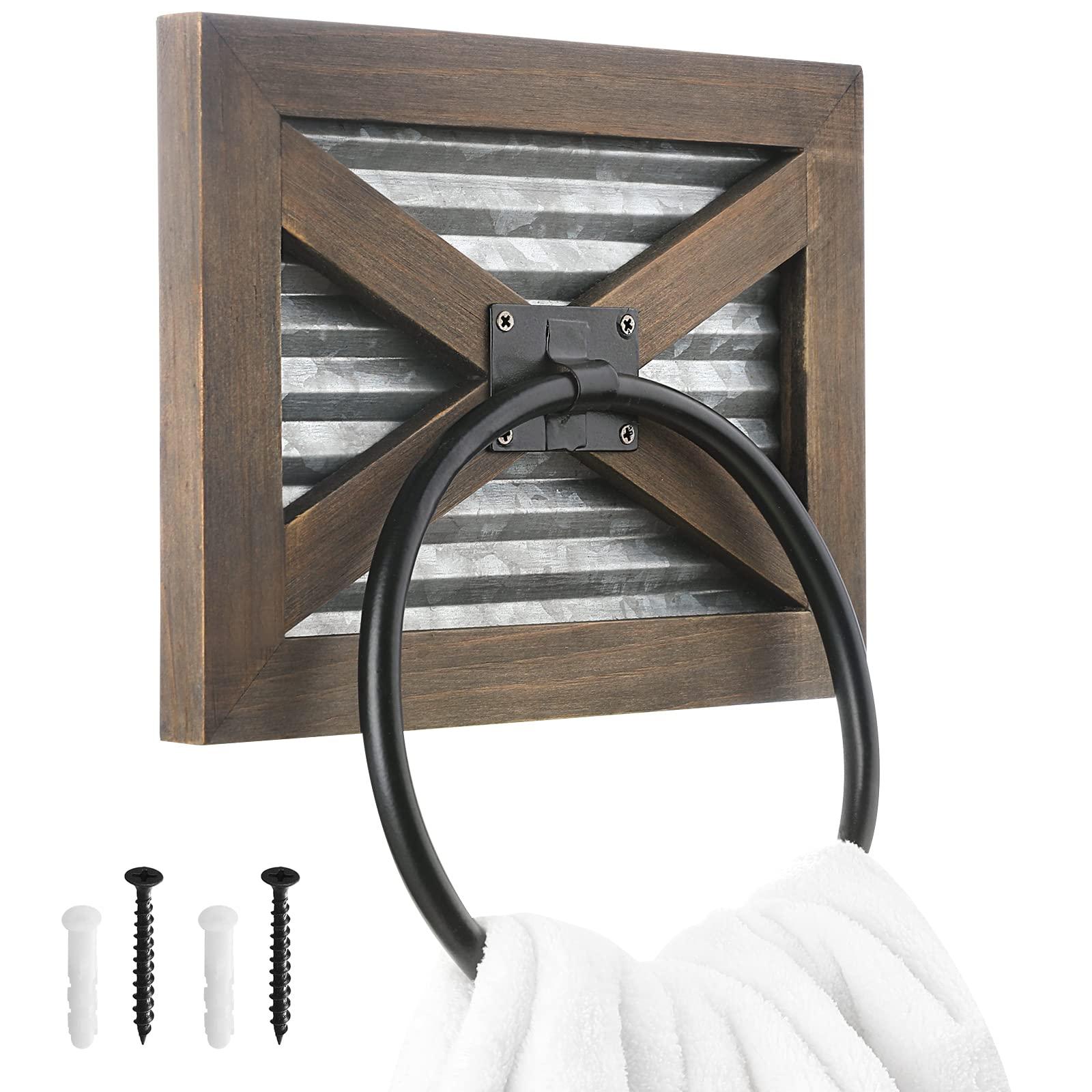 A wrought-iron towel holder gives a touch of elegance to your farmhouse⁢ bathroom