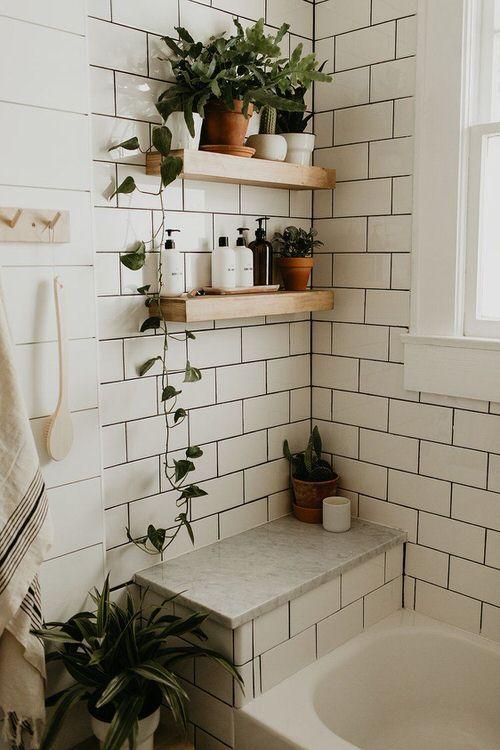 Decorate with potted plants to enhance the serene vibe of your wooden bathroom