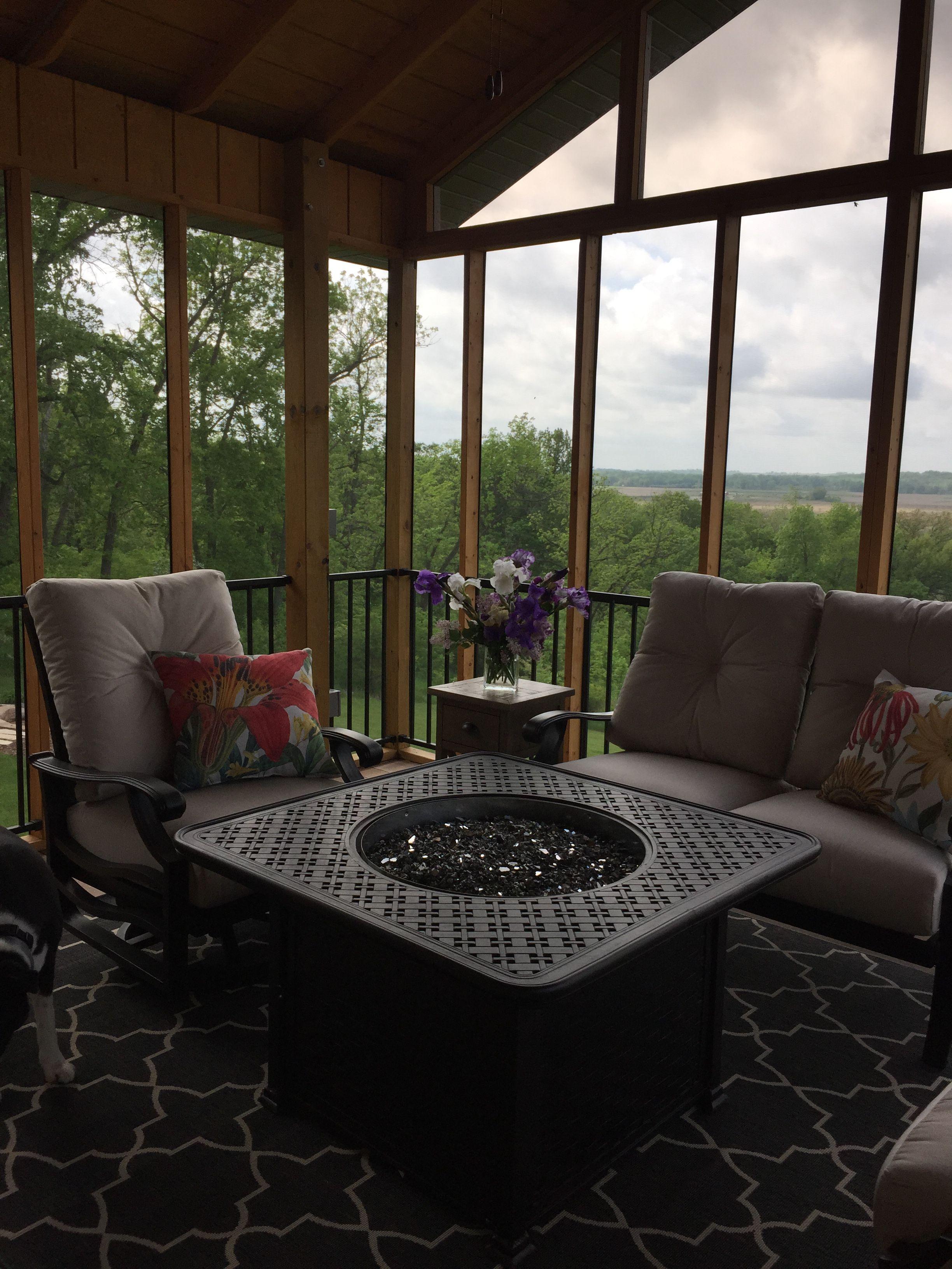 Add a fire pit for warmth and ambiance on your screened porch