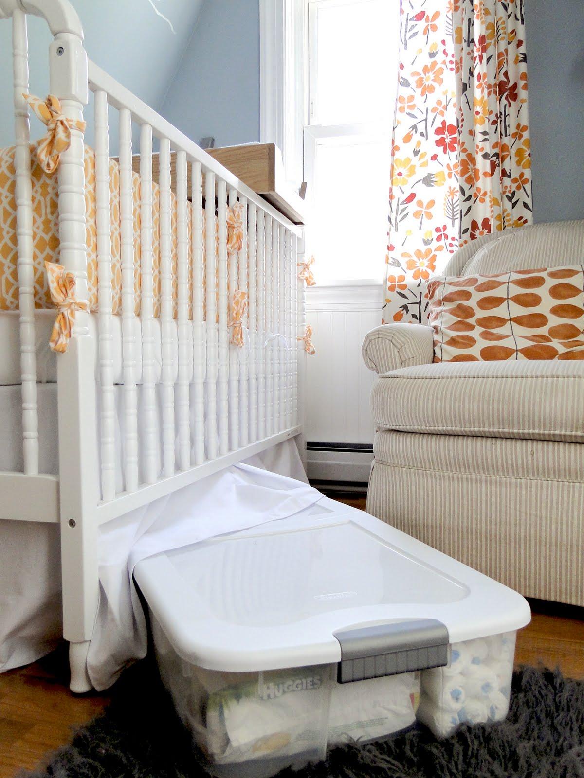 Utilize under-crib storage for toys and blankets in your small nursery