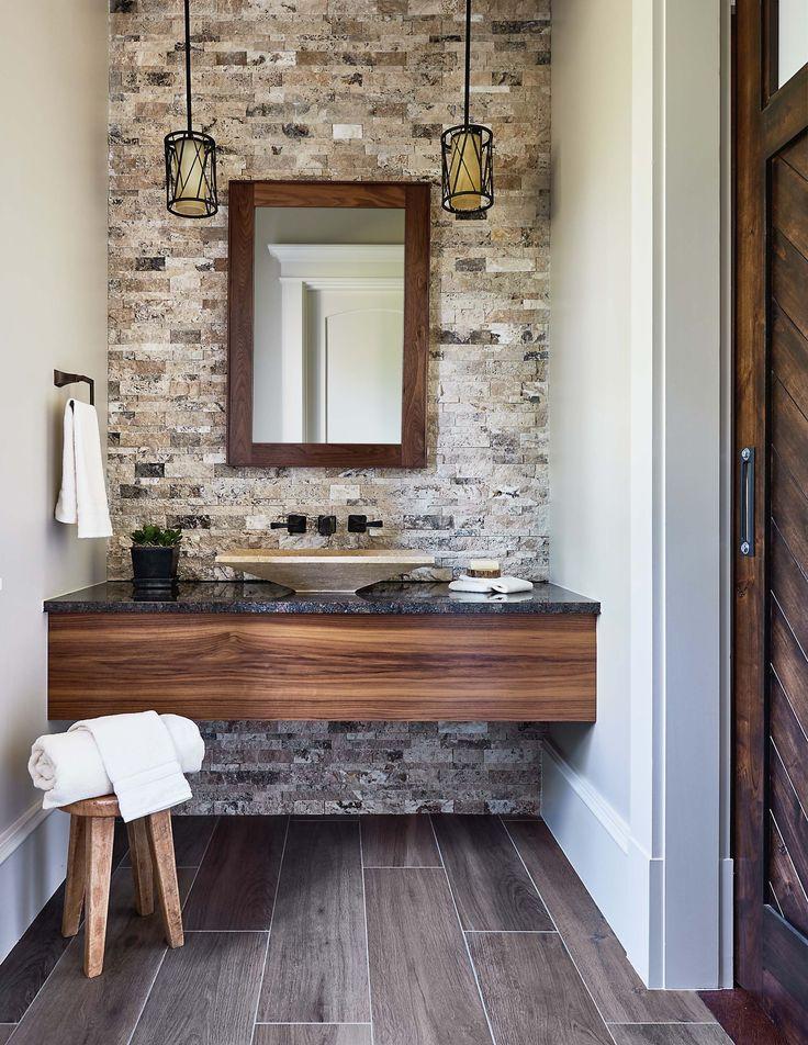 Create⁣ an ​accent wall ⁤with‌ natural stones for a grounding, eclectic bathroom effect