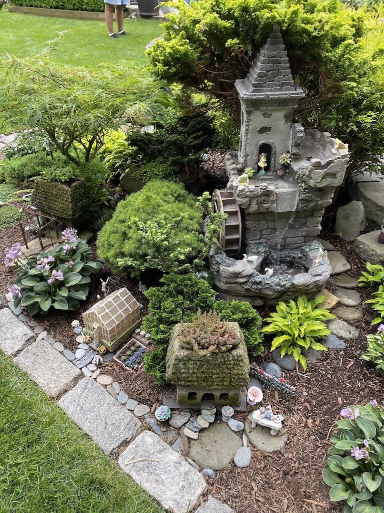 Create a small⁤ fairy garden for ‍whimsy in your backyard