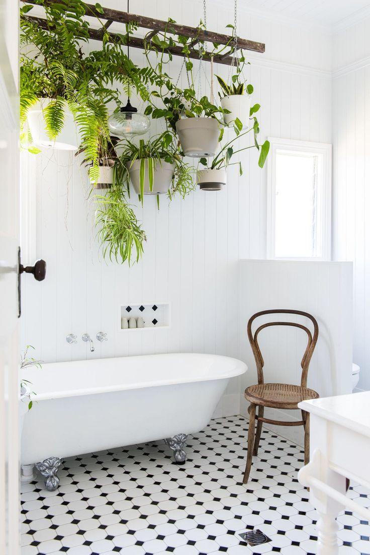 Add greenery with hanging plants to breathe life into your eclectic bathroom