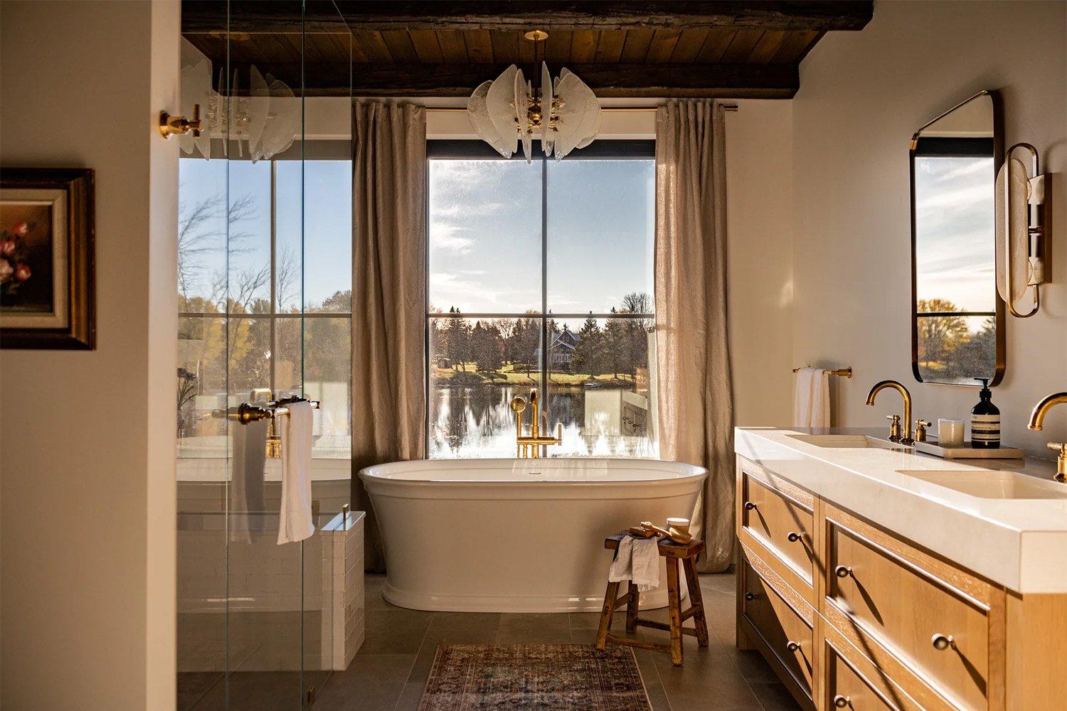 Embrace natural light with large windows in your cozy wooden bathroom retreat