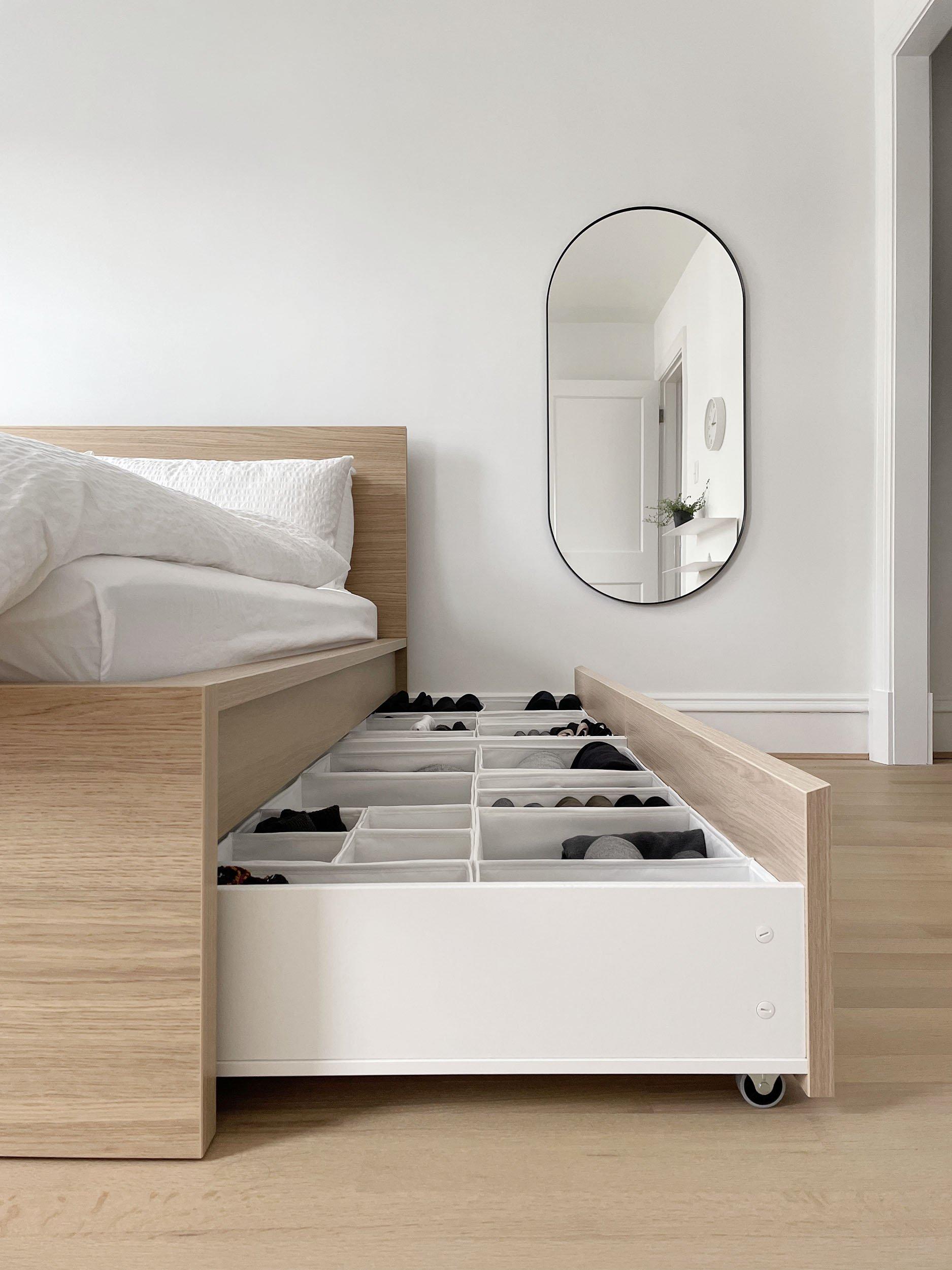 Utilize under-bed storage for a tidy minimalist bedroom