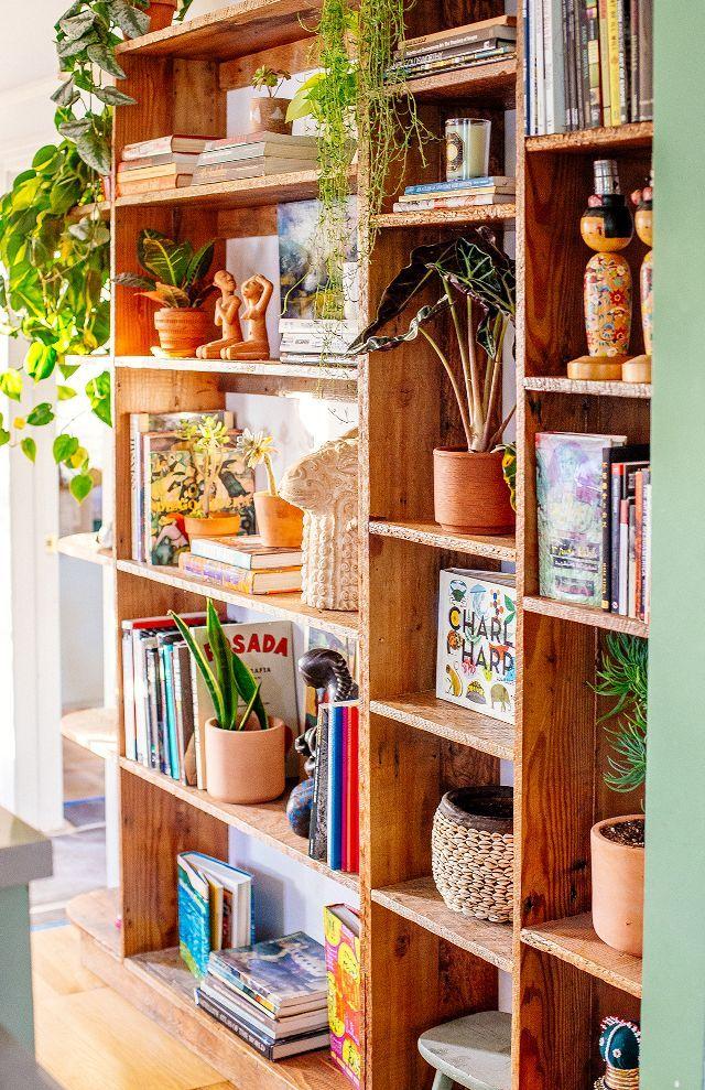 A unique bookshelf ‌displays your favorite reads and treasures‌ in‌ the‍ Boho‍ Living⁤ Room