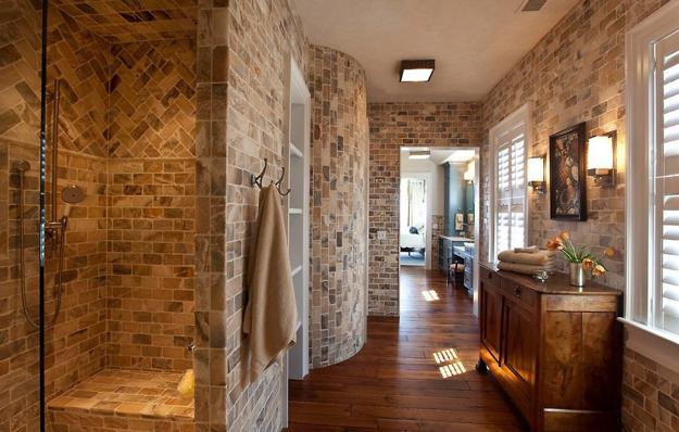 Utilize natural stone accents to complement the wood in your cozy wooden bathroom