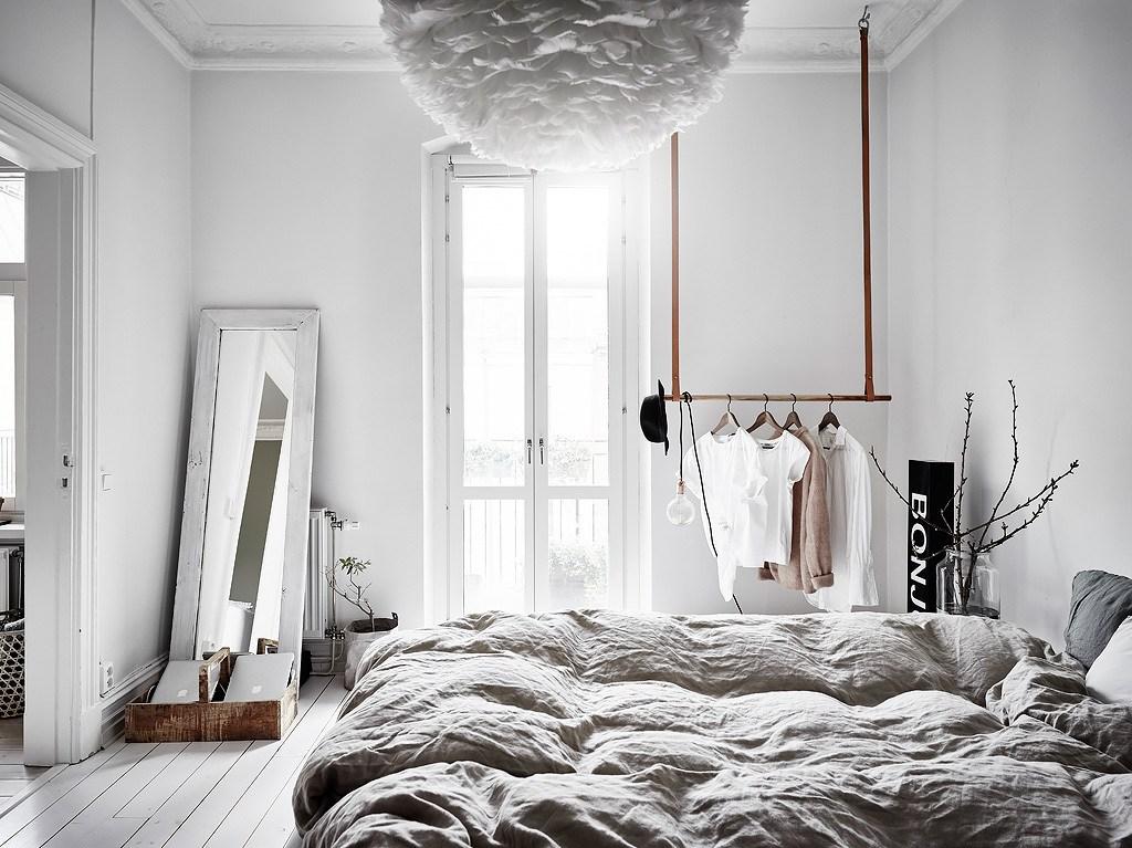 Designate a clutter-free zone​ to promote calm in your minimalist bedroom