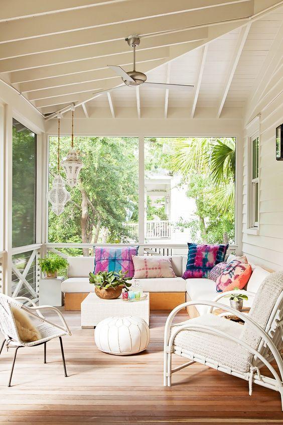 Use bold cushions for a pop of color on your screened porch