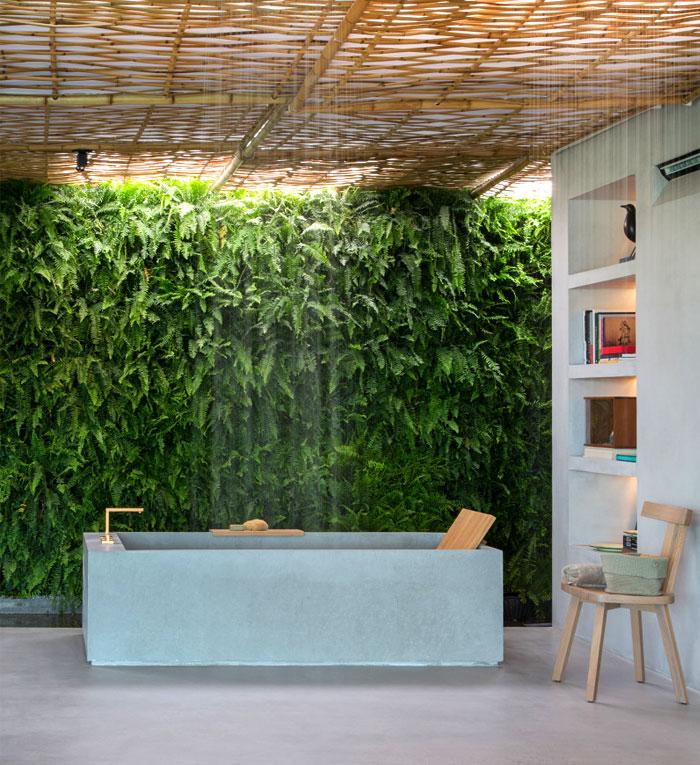 Dedicate a corner for lush greenery to enhance your eclectic bathroom atmosphere